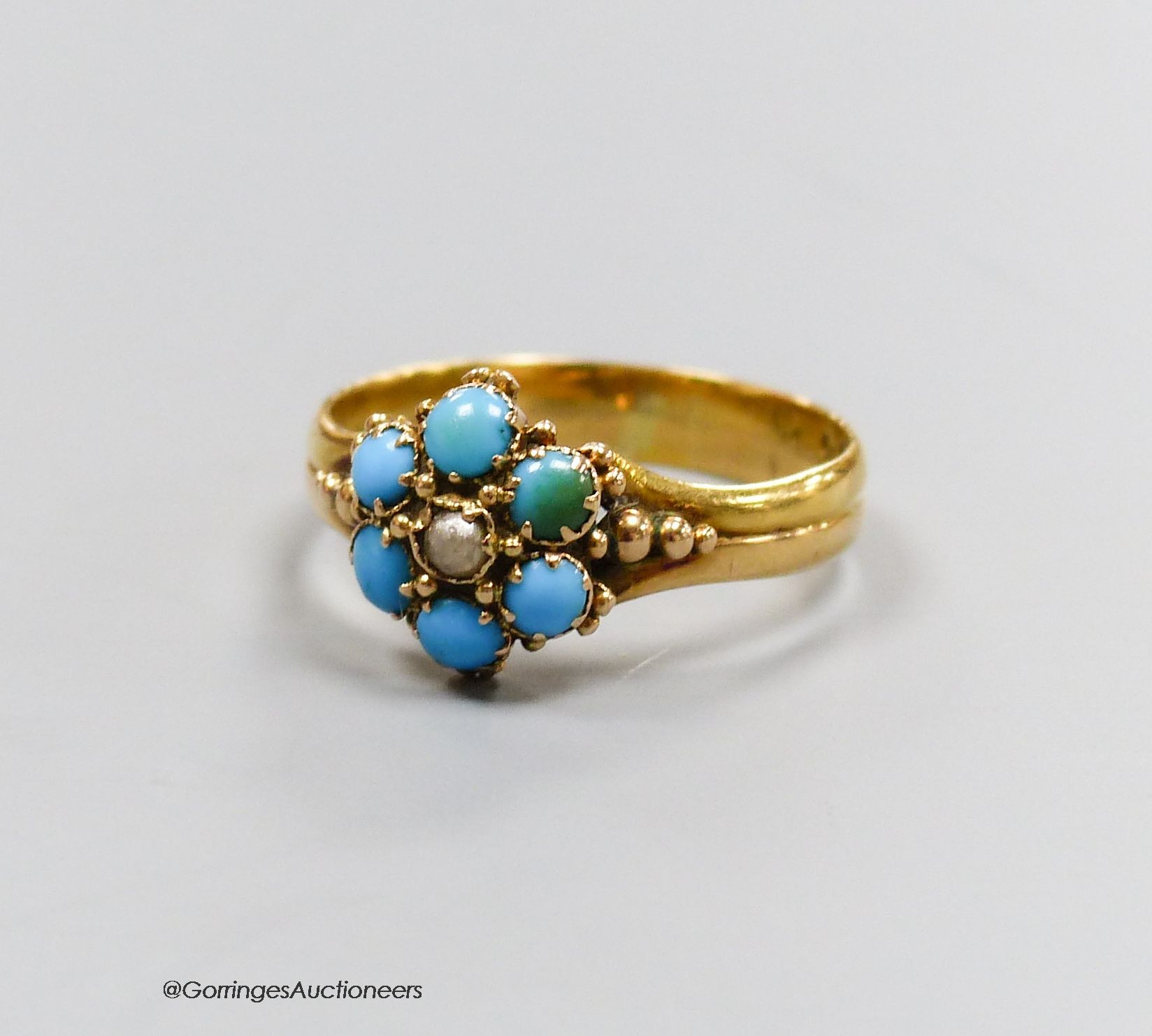 A Victorian 22ct gold, turquoise and pearl ring, size O, gross 3.3g.